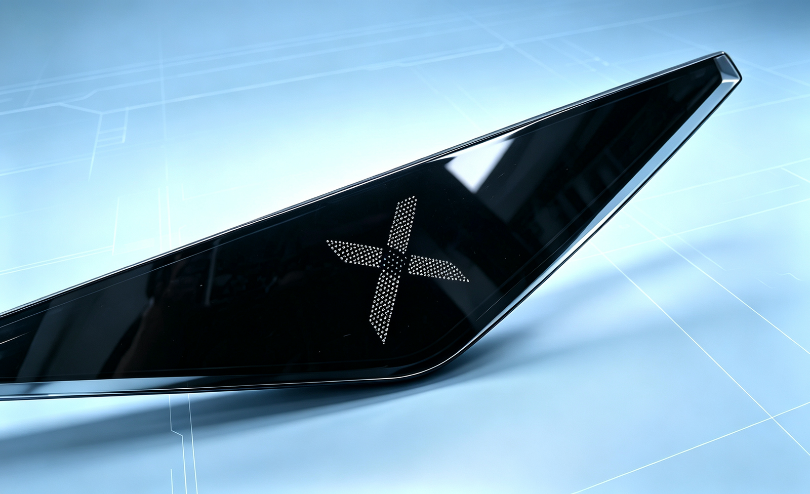 Automotive front grille with illuminated Jiometry-X X emblem on a technical grid background
